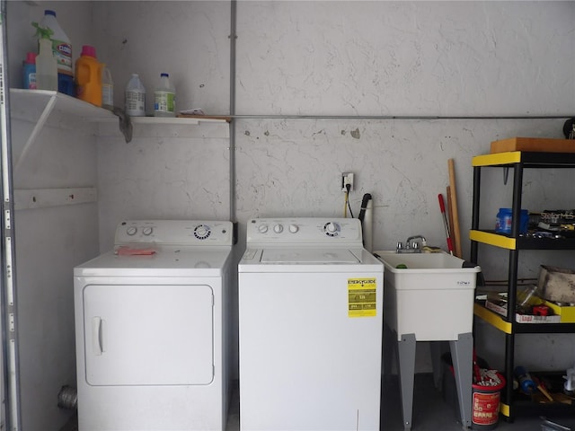 laundry area with sink and washer and clothes dryer