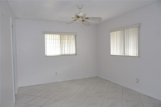 unfurnished room featuring ceiling fan