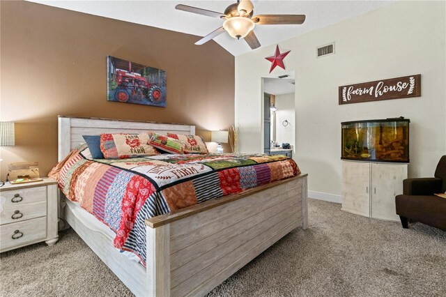 bedroom featuring ceiling fan, light colored carpet, and vaulted ceiling