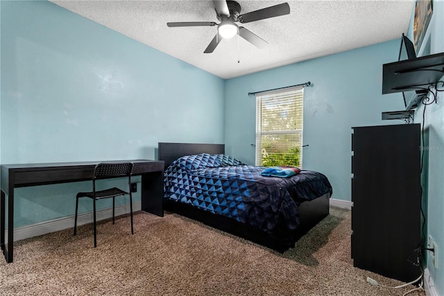 bedroom with ceiling fan, a textured ceiling, and carpet