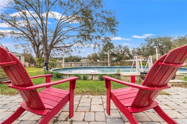 view of swimming pool featuring a patio area