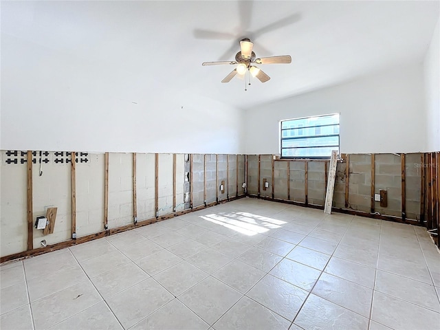 tiled empty room featuring ceiling fan