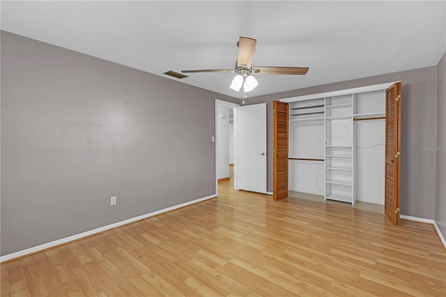 unfurnished bedroom with ceiling fan, a closet, and light hardwood / wood-style floors