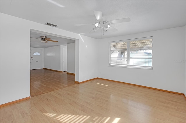 unfurnished room featuring ceiling fan and light hardwood / wood-style floors