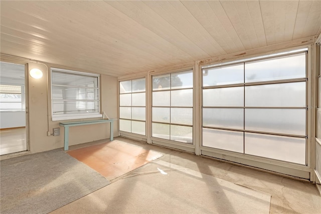 unfurnished sunroom featuring wooden ceiling