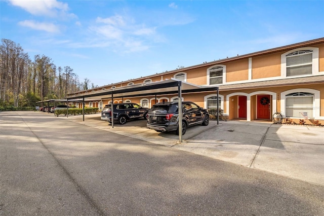 view of car parking with a carport