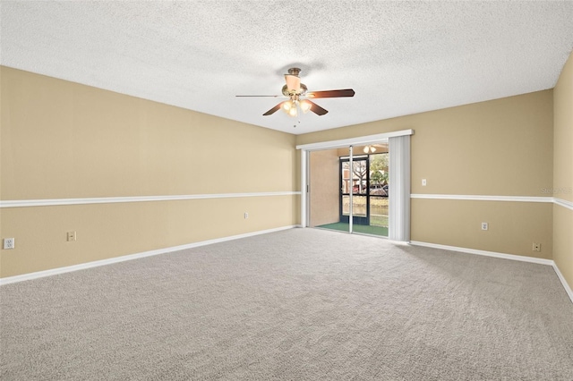 empty room with carpet flooring, a textured ceiling, and ceiling fan