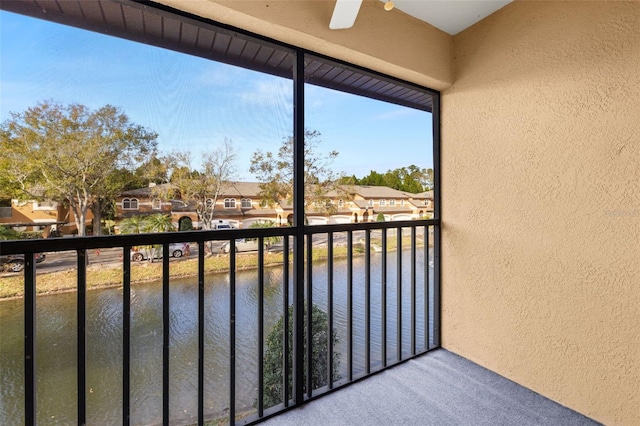 balcony featuring a water view