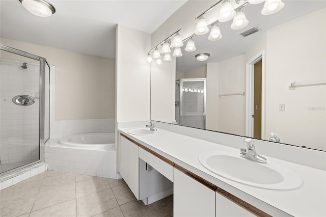 bathroom featuring tile patterned floors, vanity, and separate shower and tub