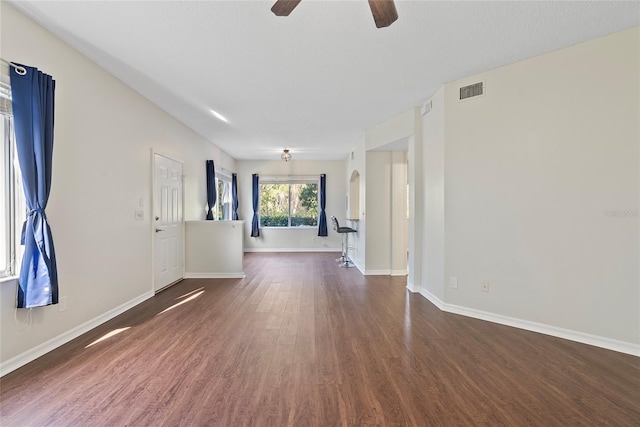 interior space featuring ceiling fan and dark hardwood / wood-style flooring