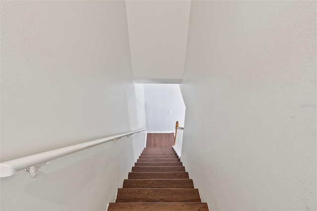 stairway featuring hardwood / wood-style floors