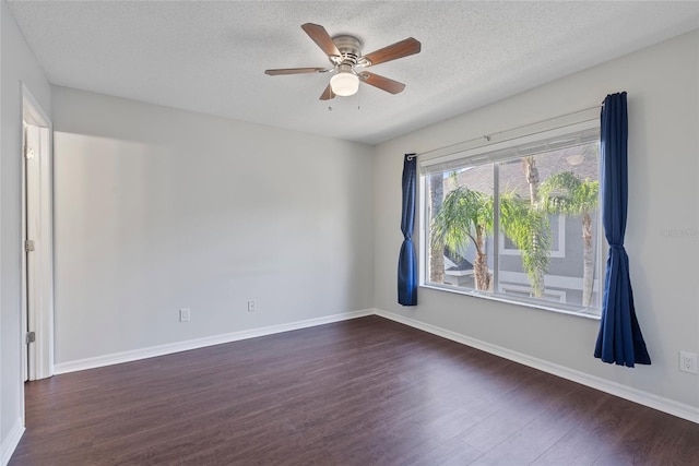 unfurnished room featuring ceiling fan, dark hardwood / wood-style floors, and a textured ceiling