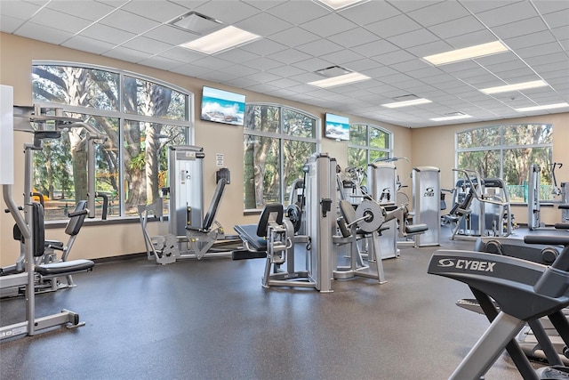 workout area featuring a paneled ceiling