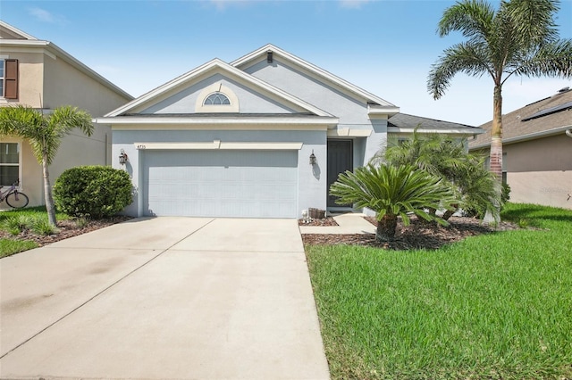 view of front facade featuring a front lawn and a garage