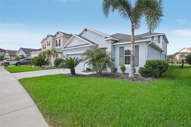 view of front facade featuring a front yard and a garage