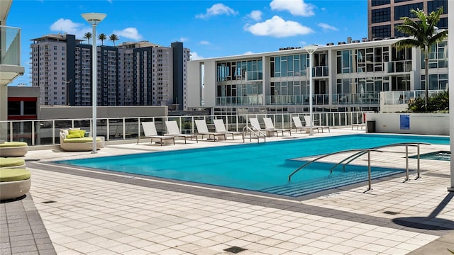 view of swimming pool with a patio