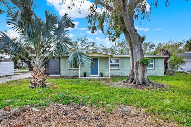 ranch-style home with a front lawn