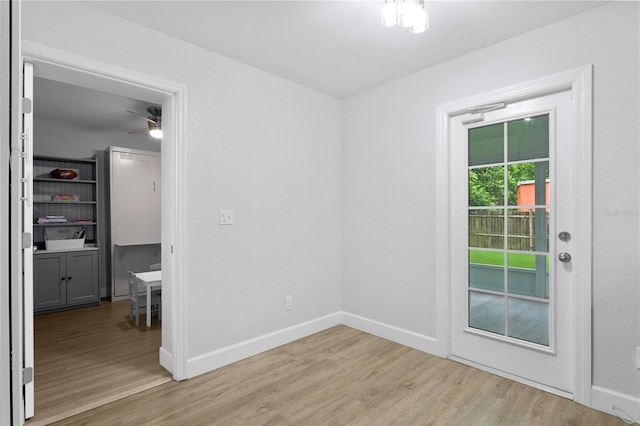 empty room featuring light hardwood / wood-style flooring and ceiling fan