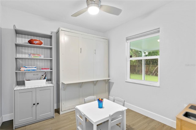 dining area featuring ceiling fan and light wood-type flooring