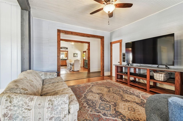 living room featuring ceiling fan and wood-type flooring