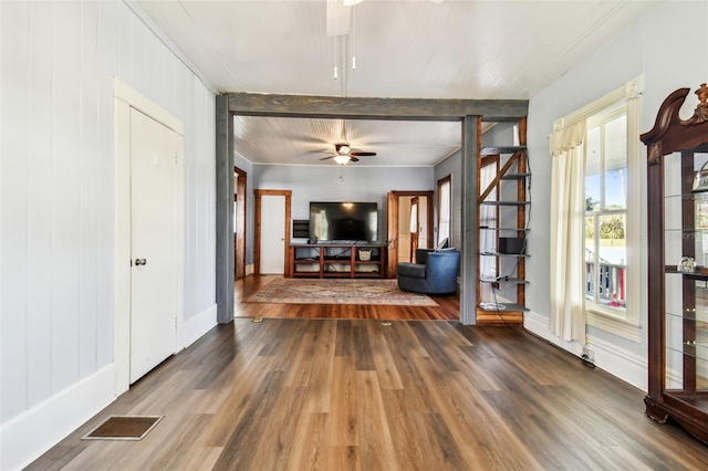 unfurnished living room with ceiling fan and hardwood / wood-style floors