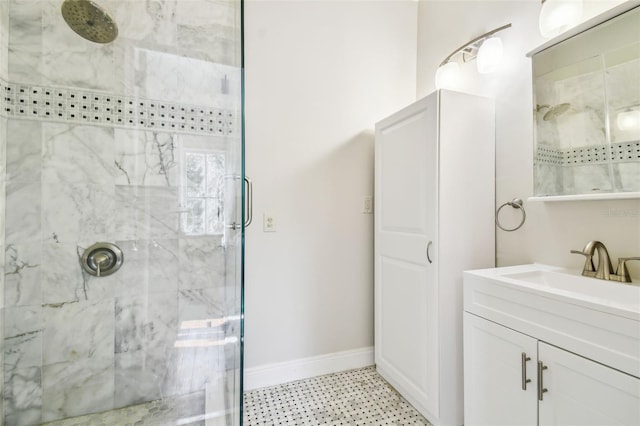 bathroom featuring vanity and a shower with shower door