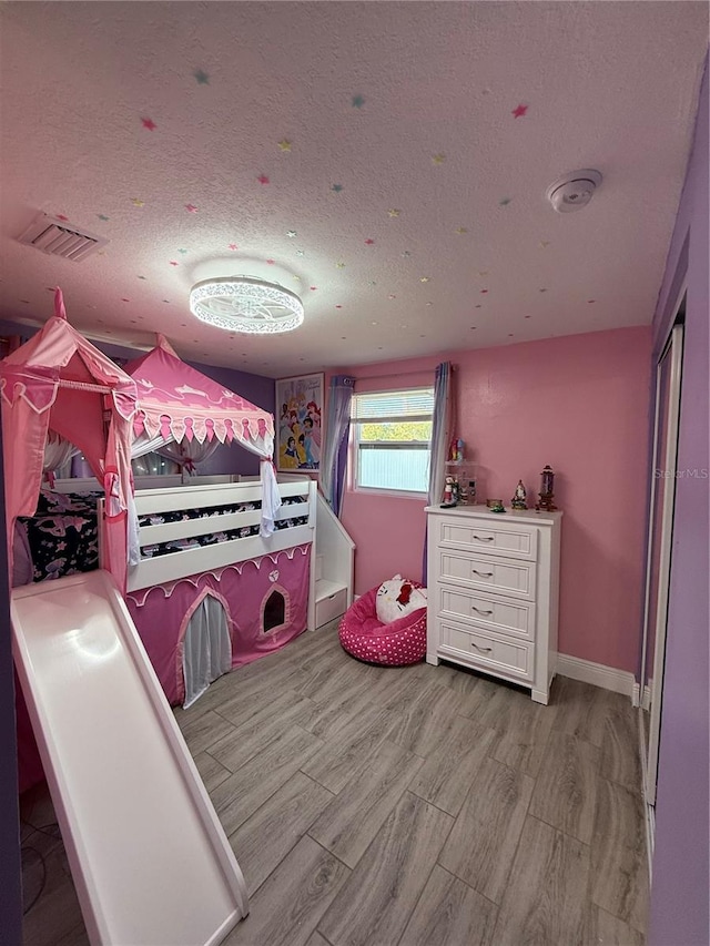 bedroom featuring a textured ceiling