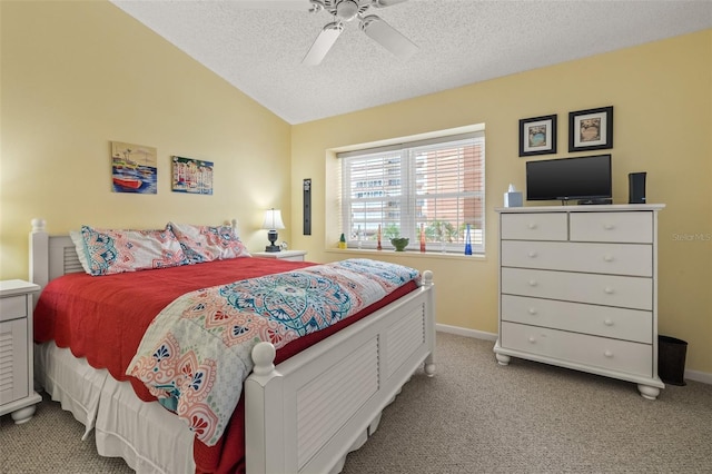 bedroom featuring light carpet, a textured ceiling, ceiling fan, and lofted ceiling