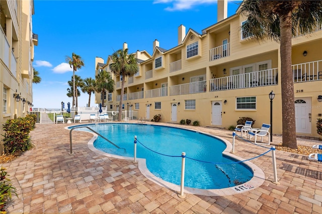 view of swimming pool featuring a patio area