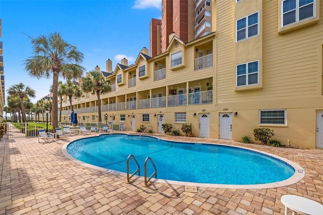 view of swimming pool featuring a patio area