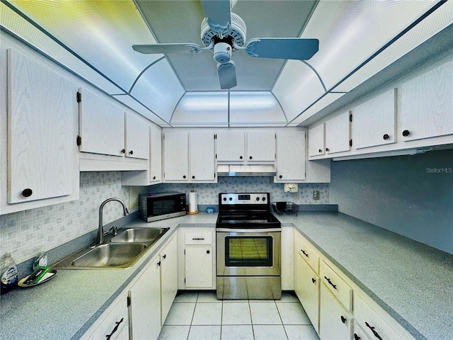 kitchen with sink, ceiling fan, light tile patterned floors, tasteful backsplash, and stainless steel appliances