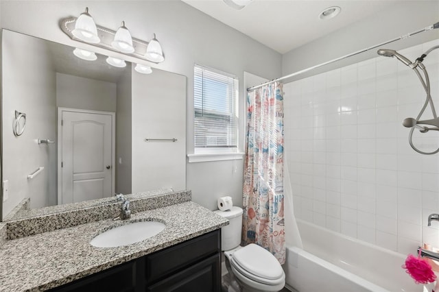 full bathroom featuring vanity, shower / tub combo, and toilet