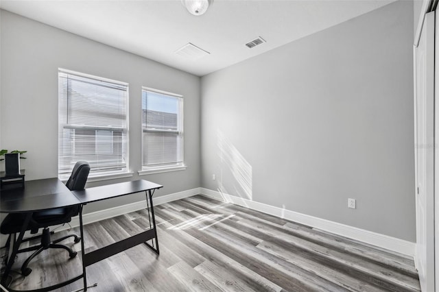 office space with hardwood / wood-style flooring