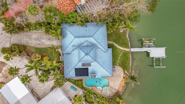 birds eye view of property with a water view