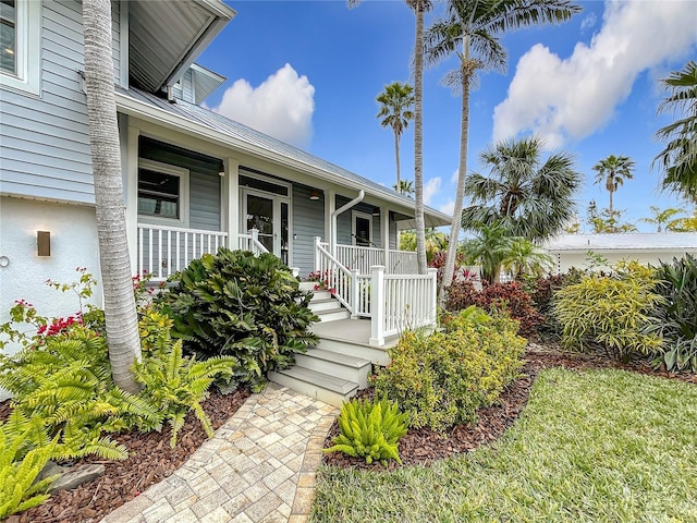 doorway to property with covered porch