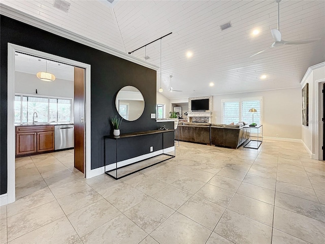 interior space with sink, wooden ceiling, lofted ceiling, ceiling fan, and stainless steel dishwasher