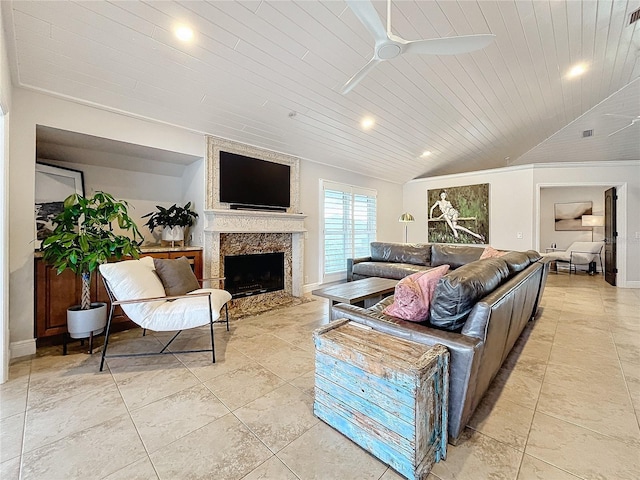 living room with ceiling fan, wood ceiling, vaulted ceiling, and a fireplace