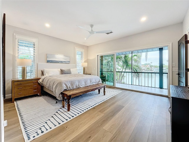 bedroom featuring access to exterior, ceiling fan, and light wood-type flooring