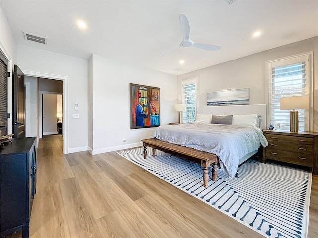 bedroom featuring ceiling fan and light hardwood / wood-style flooring