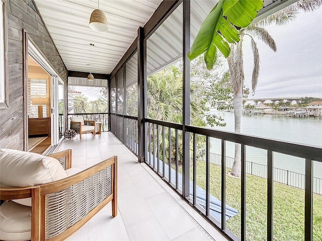 sunroom with a water view