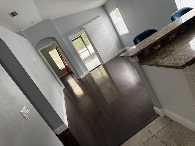 entrance foyer featuring vaulted ceiling