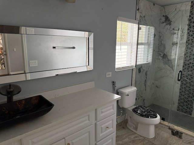 bathroom with vanity, toilet, and walk in shower