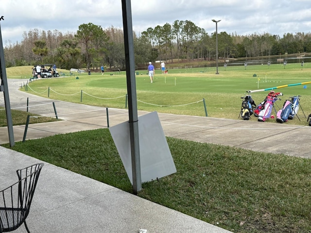 view of property's community featuring a lawn