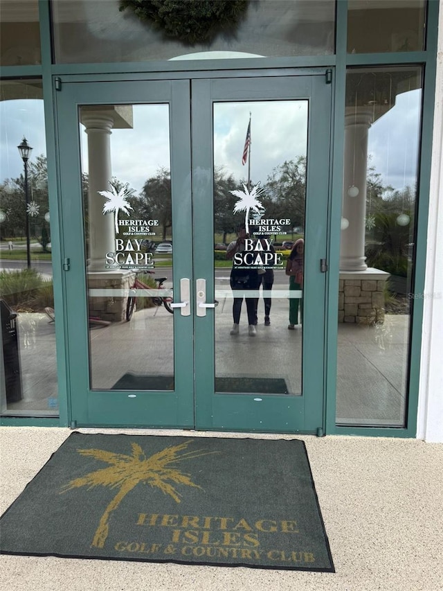 view of exterior entry featuring french doors