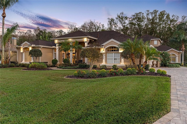 mediterranean / spanish-style house featuring a yard