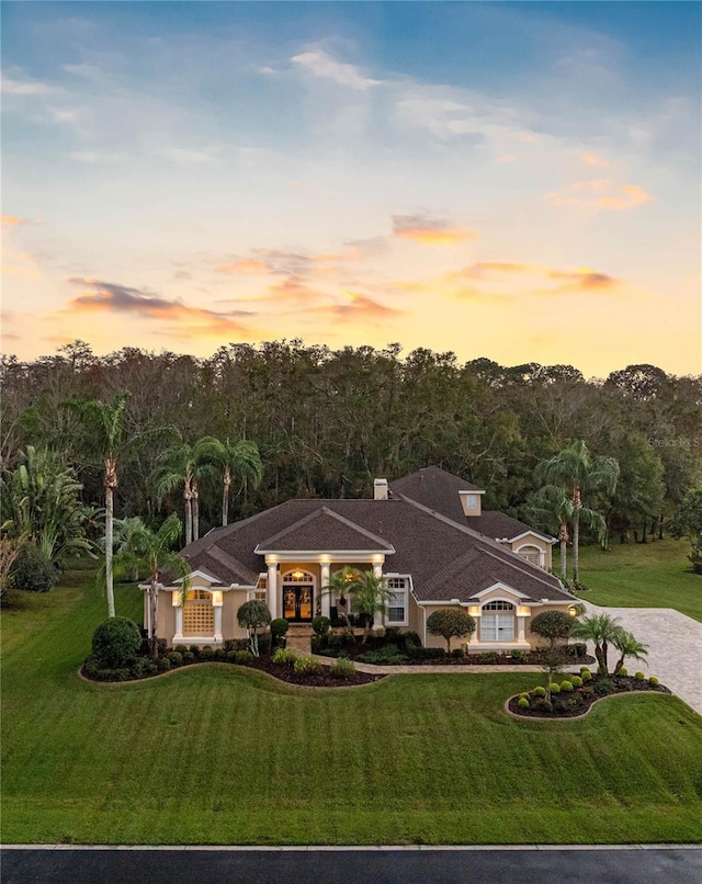 ranch-style house with a yard