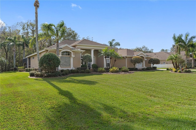 ranch-style house featuring a front lawn