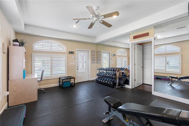 workout room featuring ceiling fan