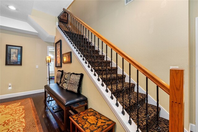 stairway featuring hardwood / wood-style flooring