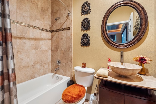 full bathroom with vanity, shower / tub combo, and toilet